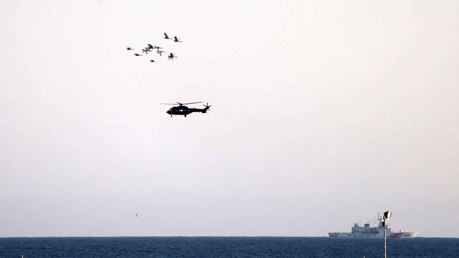 Capsized ferry disaster kills at least eight, as search for survivors continues
