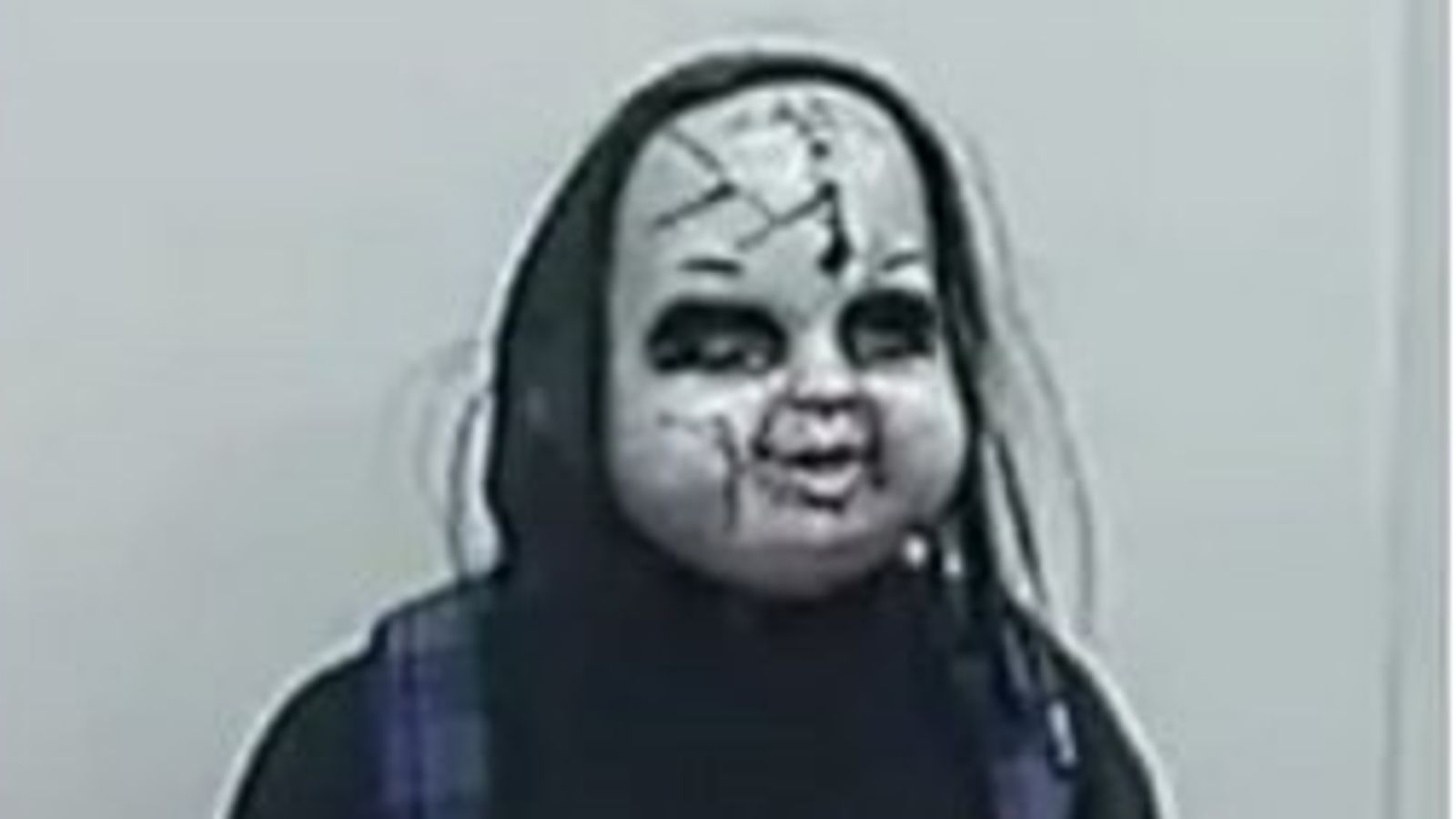 Hunt for 'Chucky-style' masked man who chased woman