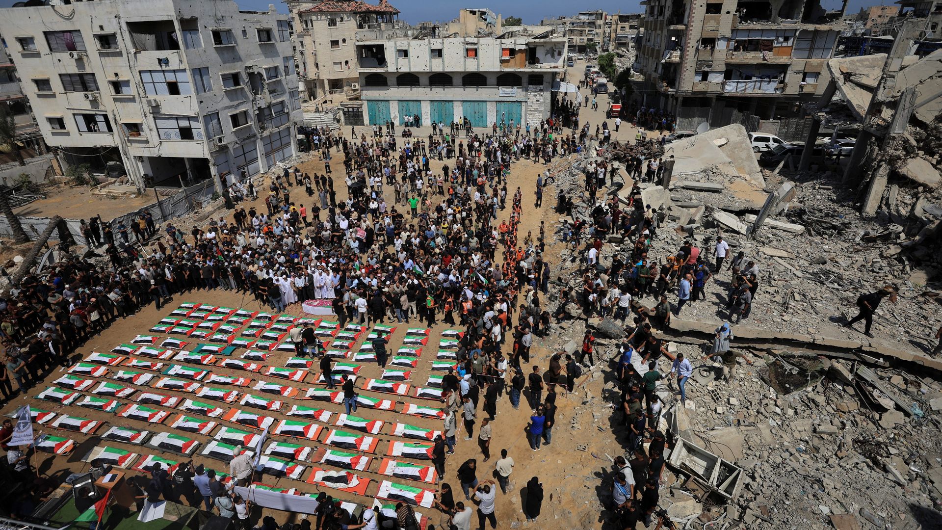 Funeral held for 112 victims buried under rubble of Gaza flats for nearly three years