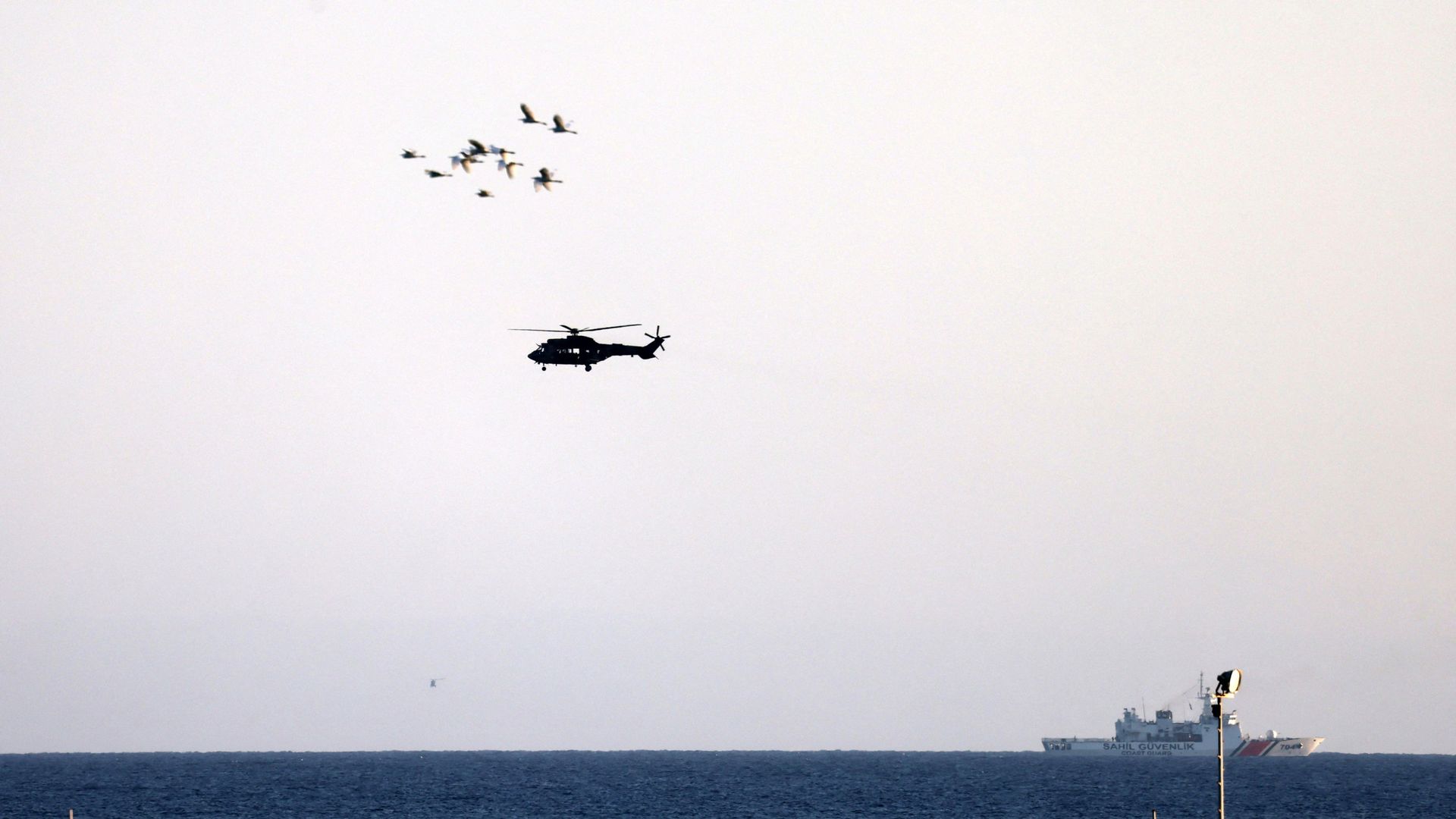Capsized ferry disaster kills at least eight, as search for survivors continues