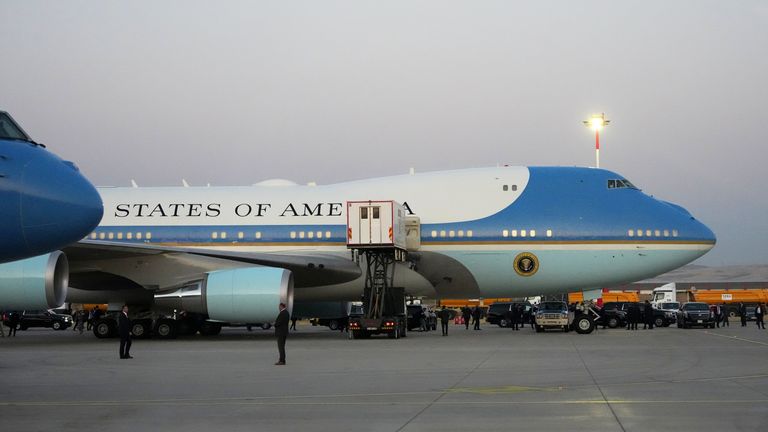 The outlets reported Mr Trump was taken off Air Force One by a catering truck, seen in the middle of the photo. Pic: AP