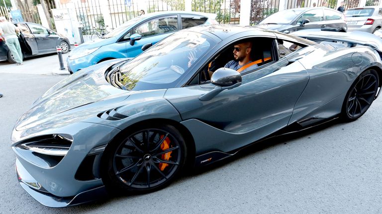 Andrew Tate, pictured driving a McLaren 765LT Spider super-car in 2024, flaunts a flamboyant lifestyle. Pic: EPA-EFE/Shutterstock