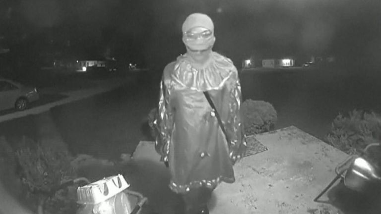 Doorbell footage showed the suspect walking around the area with a knife. Pic: NBC