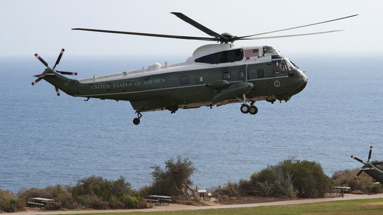 An aircraft with Mr Trump on board lands near the golf course on Tuesday. Pic: AP