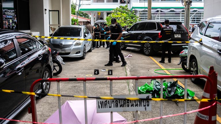 Forensic police officers inspect the site of Monday's shooting. Pic: Reuters