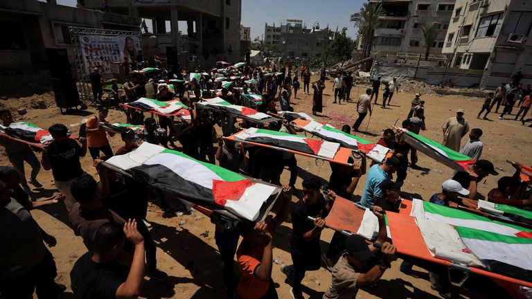 The funeral was for 112 members of the Hassayna and Abu Sharia clan. Pic Reuters
