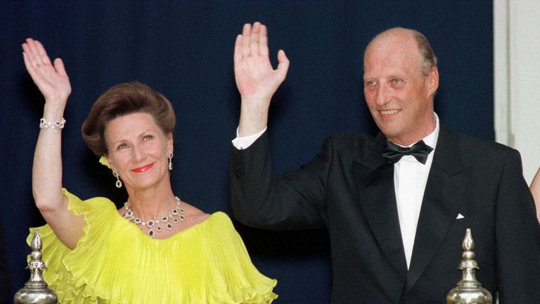 King Harald and Queen Sonja wave to well wishers from a balcony of the Royal Residence. Pic: Reuters