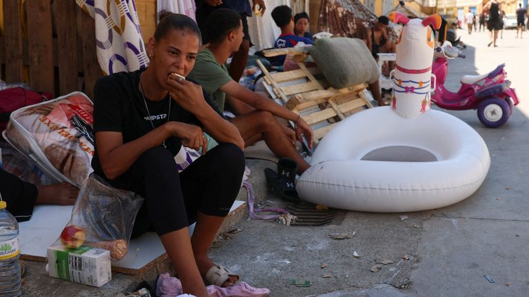 Migrants in an industrial area of Ceuta. Pic: Reuters