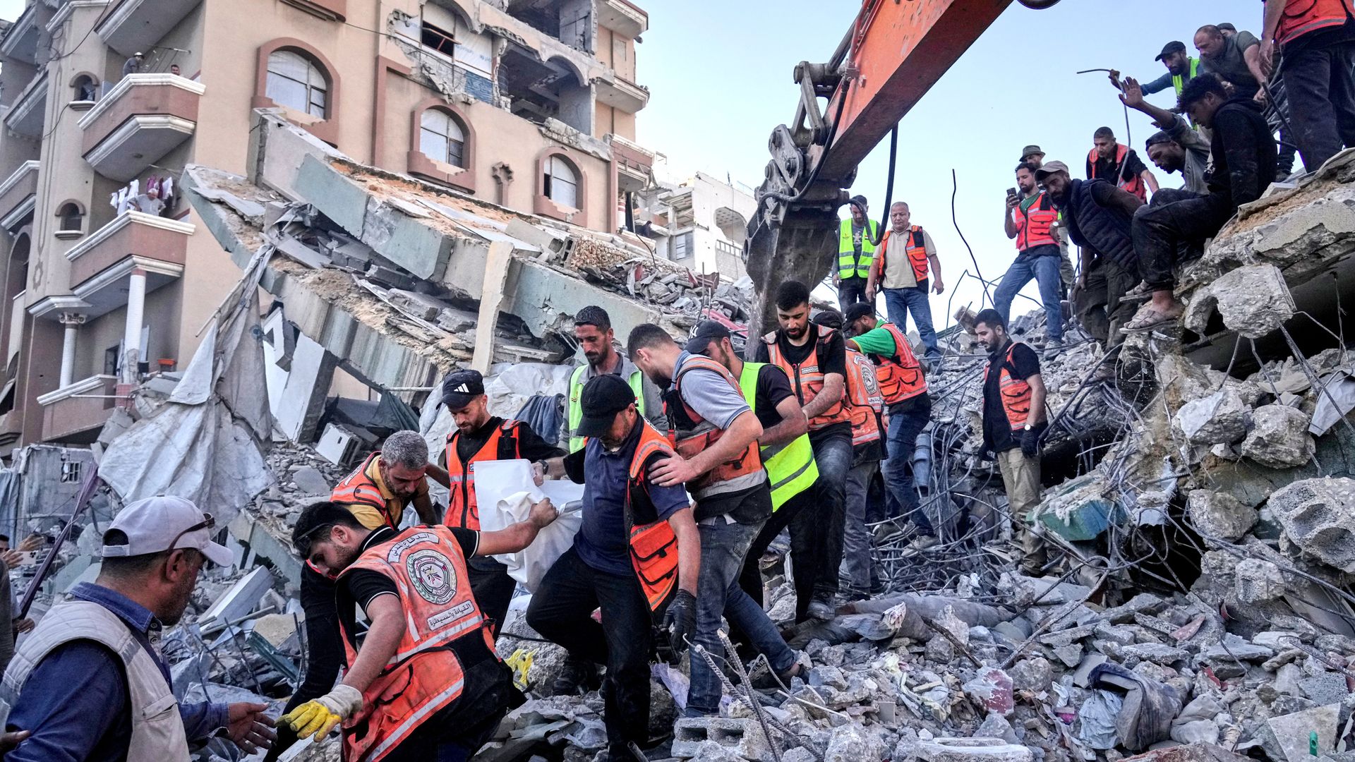 At least 20 killed and dozens trapped after war-damaged Gaza building collapses