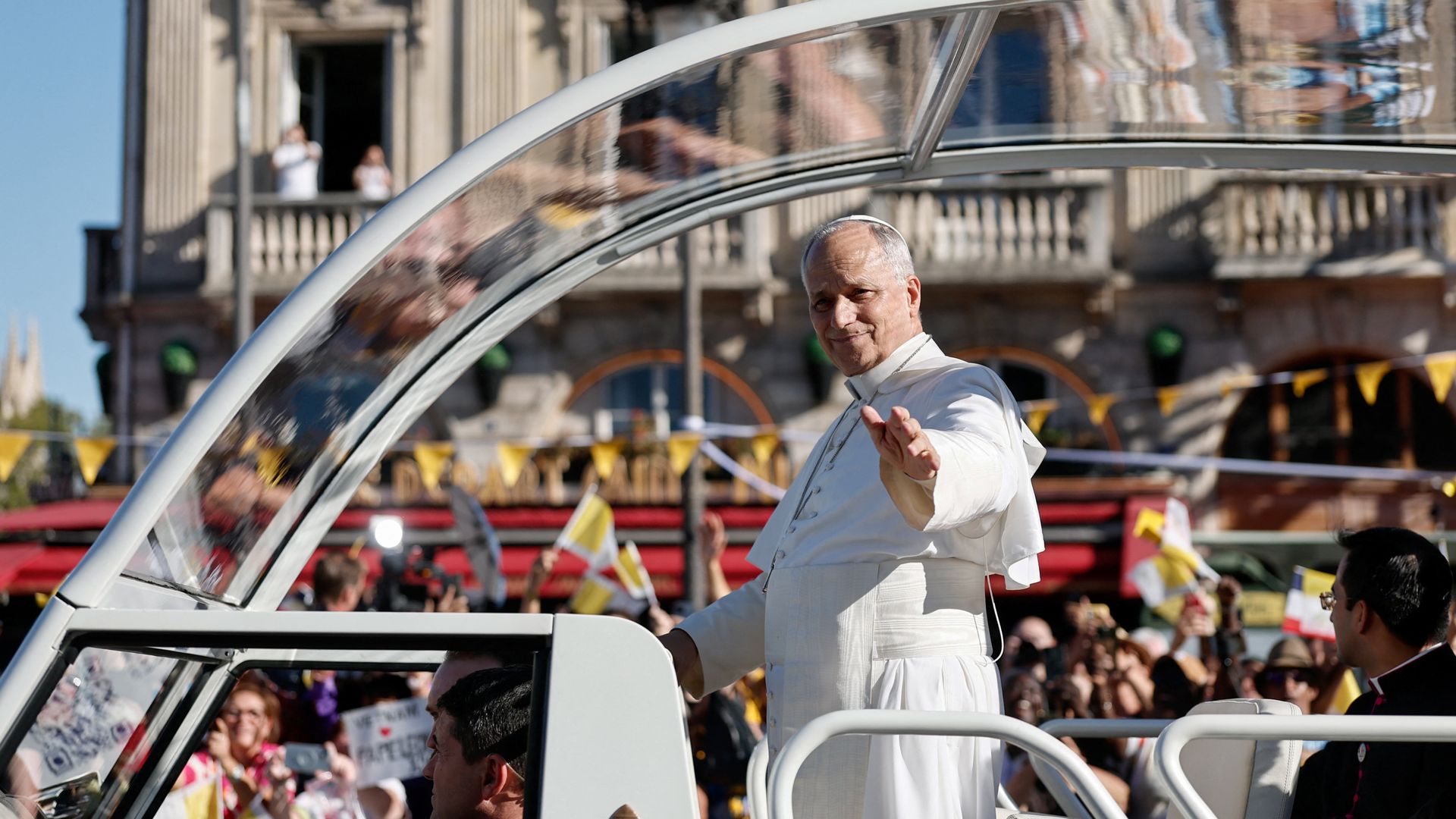 Pope greets Paris crowds in popemobile as he warns of AI risks