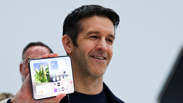 Apple CEO John Ternus holds the new foldable iPhone Duo. Pic: Reuters