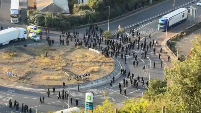 Dozens of protesters were seen blocking a roundabout
