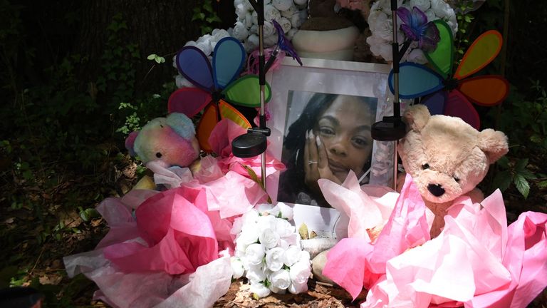 A makeshift memorial honouring Tasia Fortune stands in the backyard of the property where her body was found. Pic: AP