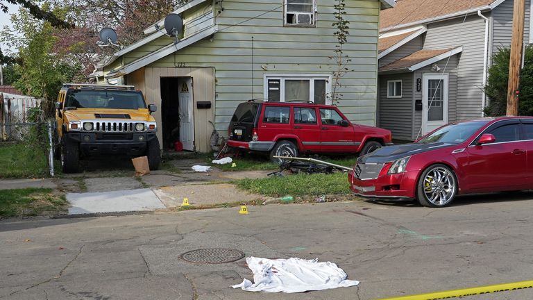 Police barrier tape cordoned off the house in Erie. Pic: WJET via AP