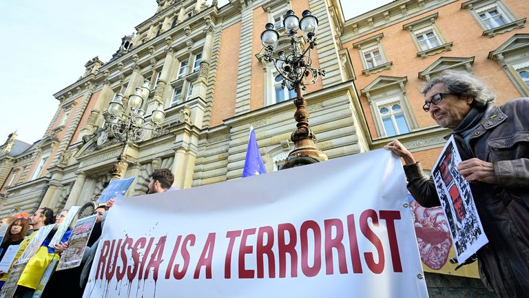 Protesters outside the court on the first day of the trial in Hamburg. Pic: Reuters