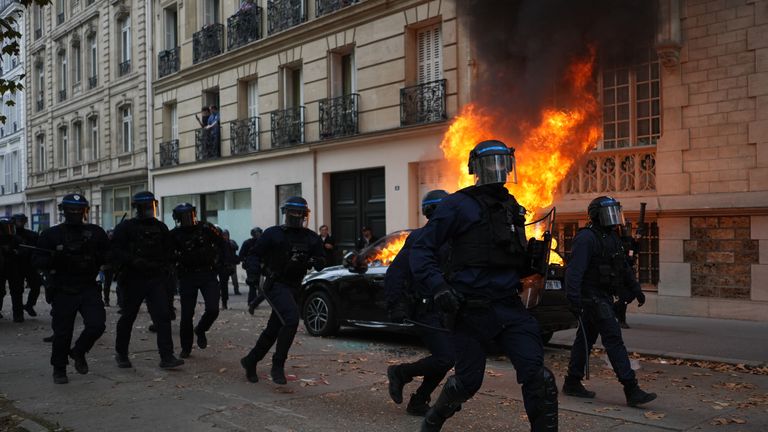 Nearly 1,000 officers were injured in the protests, the French interior minister has said