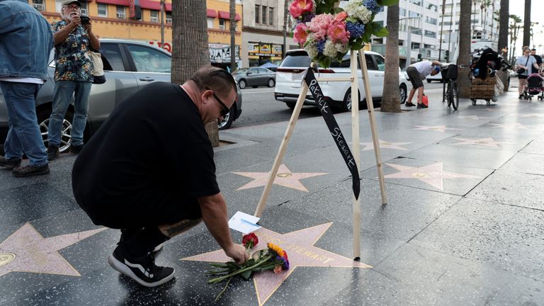 People have begun leaving flowers on Stewart's Hollywood star. Pic: Reuters